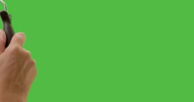 Close Up of Female Hand Using Paint Roller To Cover Entire Green Screen.