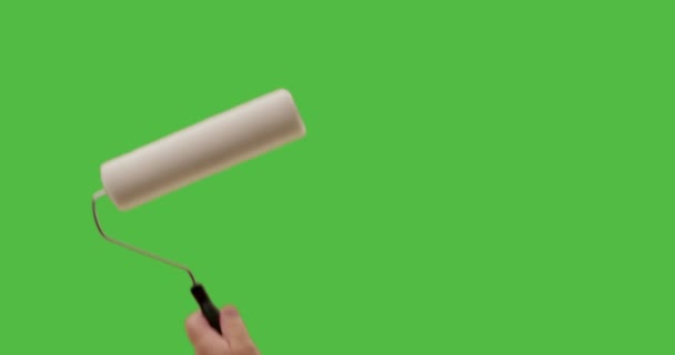 Male Using Paint Roller Strokes Green Screen — Stock Video