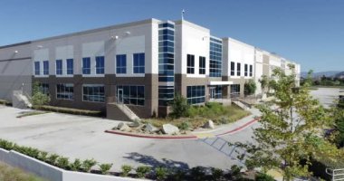 4K Aerial View of New Commercial Industrial Building.
