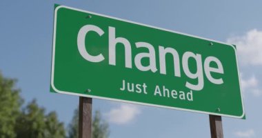 4k Pan of Change Just Ahead Green Road Sign.
