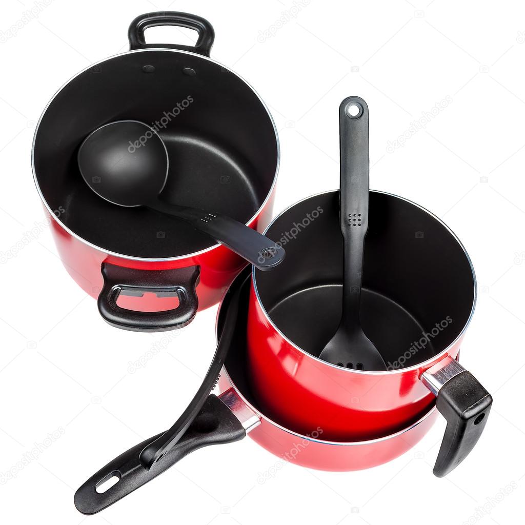 Top view of red cooking pans and pots