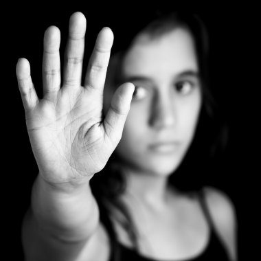 Girl with a hand signaling to stop in black and white clipart