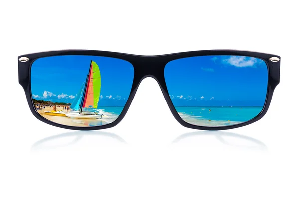 Sunglasses with a tropical beach reflection — Stock Photo, Image