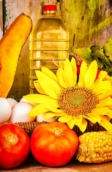 Fresh vegetables, flowers,eggs and a bottle of oil — Stock Photo, Image