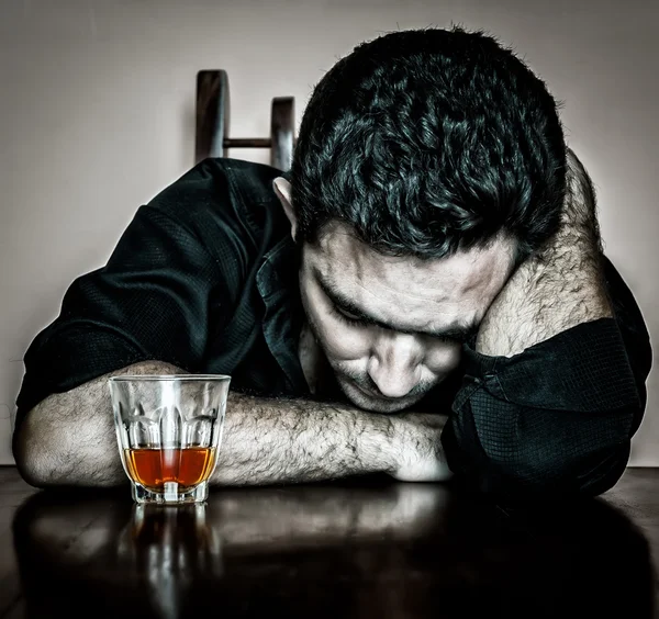 Portrait of a lonely and desperate drunk hispanic man — Stock Photo, Image