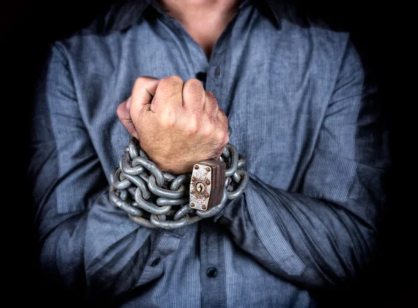 Hands of a formally dressed man chained together — Stock Photo, Image