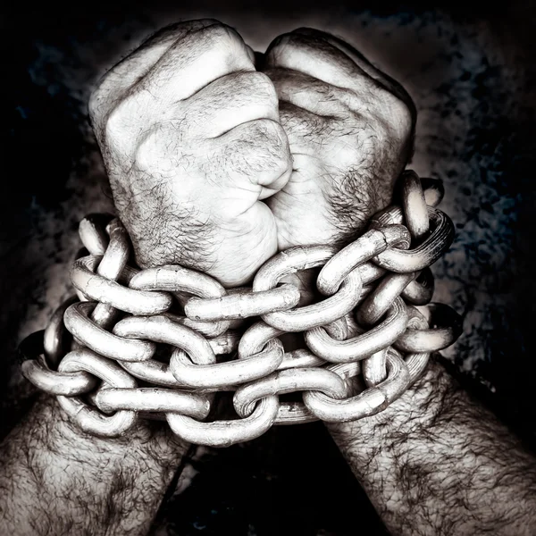 Hands locked by a strong chain — Stock Photo, Image