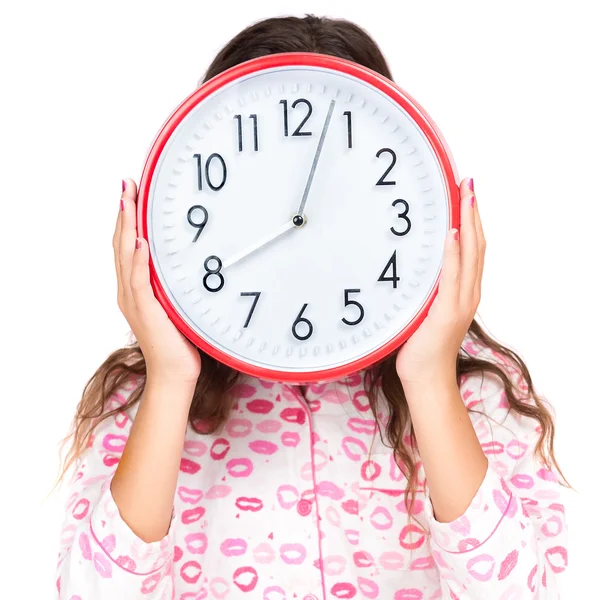 Criança de pijama usando um relógio no lugar de seu rosto — Fotografia de Stock