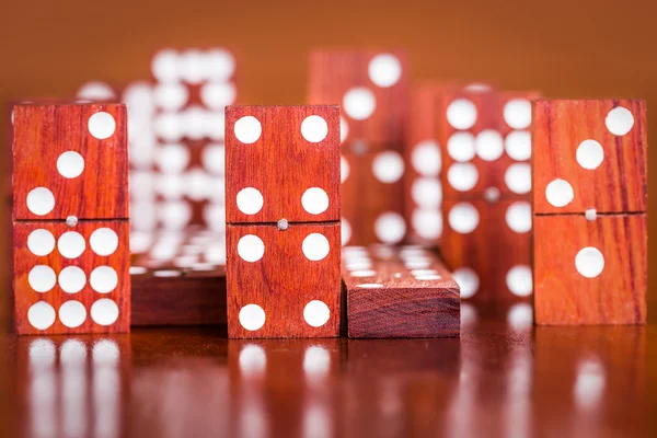 Dominoes with out of focus pieces in the back — Stock Photo, Image