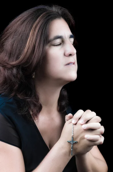 Hispanic woman praying with her eyes closed — Stock Photo, Image