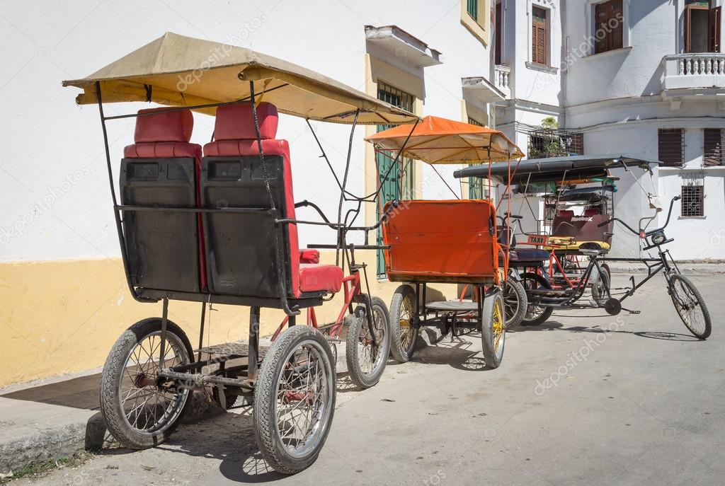 Three wheeled bicycles in Old Havana