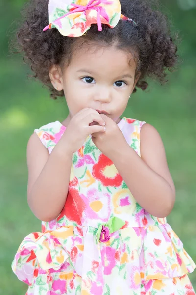 Cute and innocent latin girl with a colorful dress — Stock Photo, Image