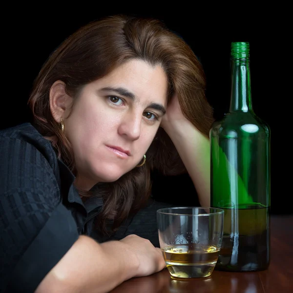 Portrait of a latin woman drinking alone — Stock Photo, Image