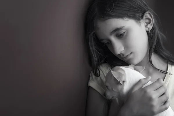 Sad and lonely girl and her small dog — Stock Photo, Image