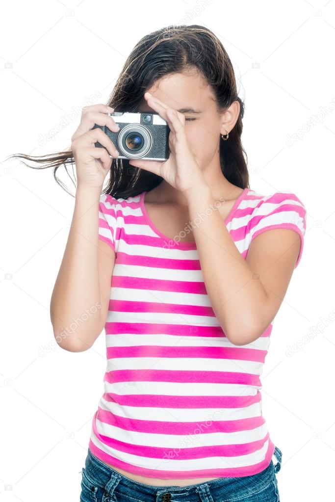 Cute young girl taking a photo
