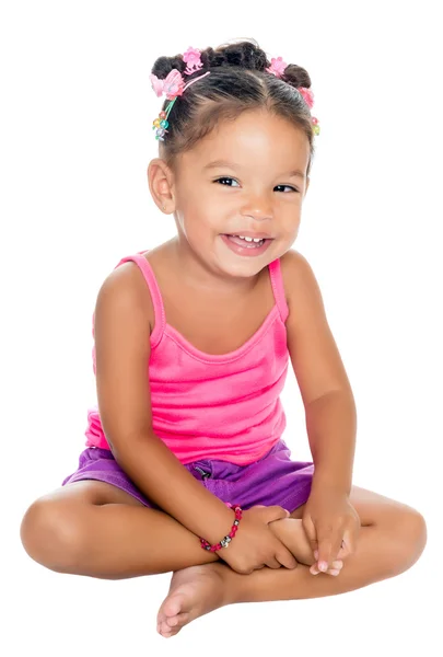 Multiracial small girl laughing sitting on the floor — Stock Photo, Image