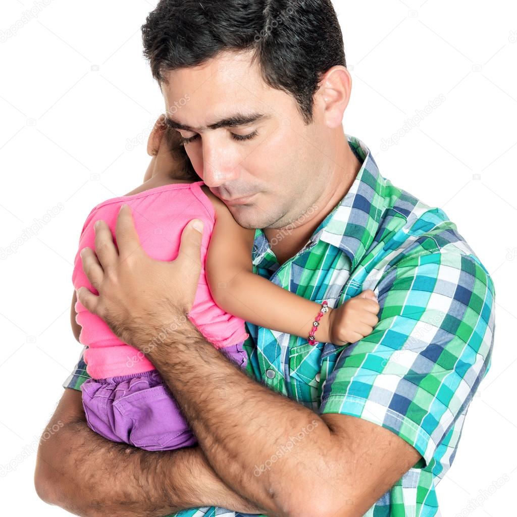 Tired hispanic father carrying his small daughter