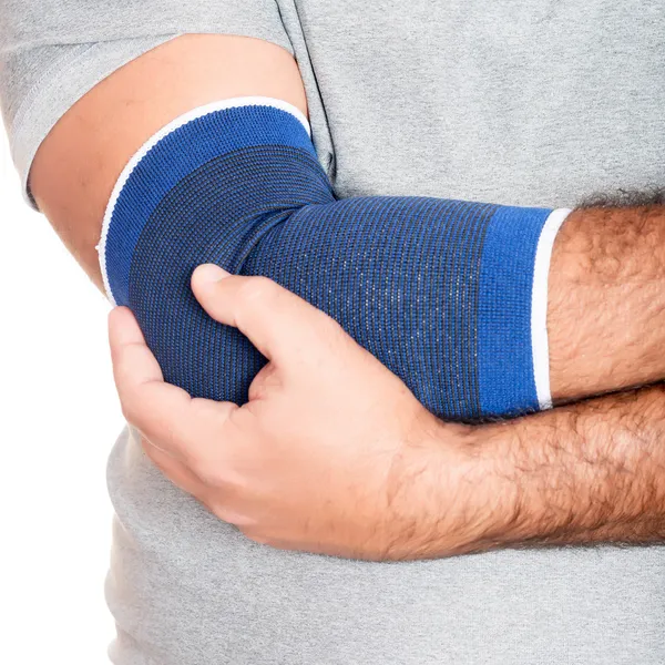 Man with a therapeutic elastic band on his elbow — Stock Photo, Image