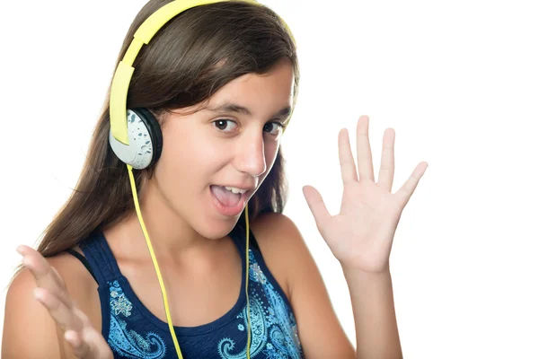 Hispanic teen listening to music with an excited expression — Stock Photo, Image