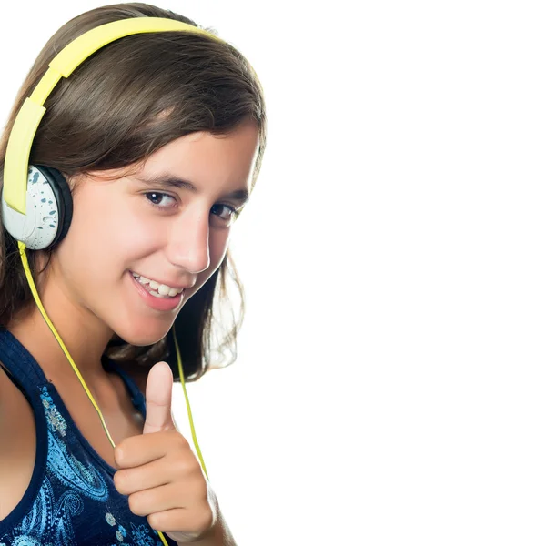 Beautiful hispanic teenager listening to music — Stock Photo, Image