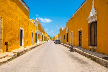Typical yellow houses at the magical town of Izamal in Yucatan, Mexico clipart
