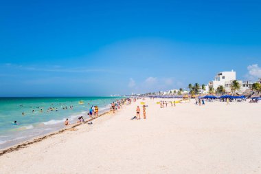 PROGRESO,MEXICO - AUGUST 1,2022 : People enjoying summer at Progreso, a popular beach town near Merida in Mexico