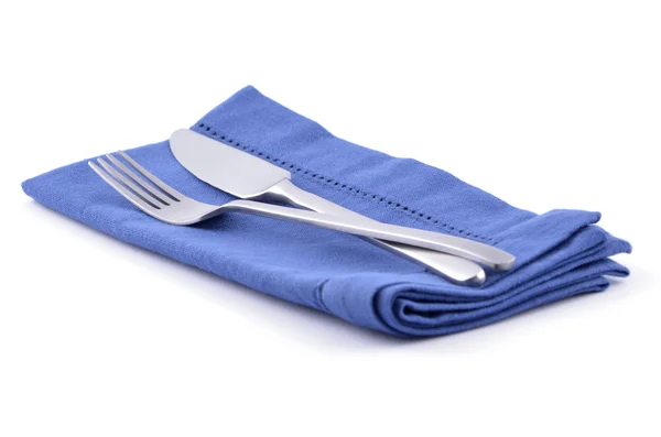 Couteau et fourchette sur serviette bleue — Photo