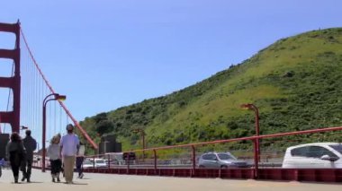 San Francisco, California, USA - April 2017: Unidentified people on the Golden Gate Bridge, 4K footage, time lapse