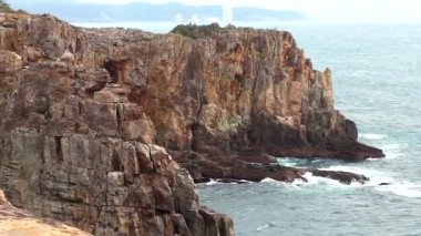 Sandanbeki Cliffs, Shirahama, Wakayama Prefecture, Japan. Sandanbeki consists of three steep cliffs with a large network of caves at water level.
