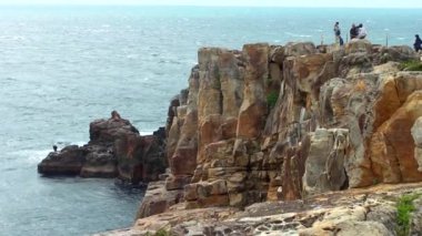 Sandanbeki Cliffs, Shirahama, Wakayama Prefecture, Japan. Sandanbeki consists of three steep cliffs with a large network of caves at water level.