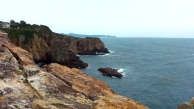 Sandanbeki Cliffs, Shirahama, Wakayama Prefecture, Japan. Sandanbeki consists of three steep cliffs with a large network of caves at water level.