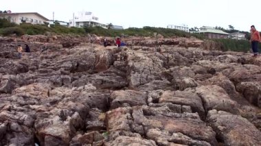 Sandanbeki Cliffs, Shirahama, Wakayama Prefecture, Japan. Sandanbeki consists of three steep cliffs with a large network of caves at water level.