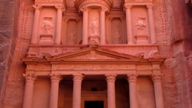 PETRA, JORDAN CIRCA 2016 - Low angle view of the facade of the Treasury building in the ancient Nabatean ruins of Petra, Jordan.