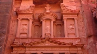 PETRA, JORDAN CIRCA 2016 - Low angle view of the facade of the Treasury building in the ancient Nabatean ruins of Petra, Jordan.