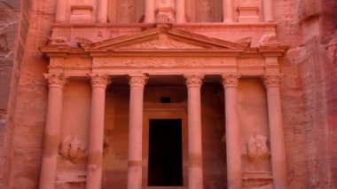 PETRA, JORDAN CIRCA 2016 - Low angle view of the facade of the Treasury building in the ancient Nabatean ruins of Petra, Jordan.