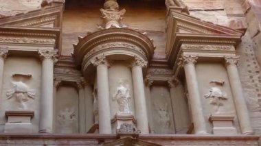 PETRA, JORDAN CIRCA 2016 - Low angle view of the facade of the Treasury building in the ancient Nabatean ruins of Petra, Jordan.