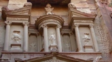PETRA, JORDAN CIRCA 2016 - Low angle view of the facade of the Treasury building in the ancient Nabatean ruins of Petra, Jordan.