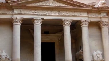 PETRA, JORDAN CIRCA 2016 - Low angle view of the facade of the Treasury building in the ancient Nabatean ruins of Petra, Jordan.