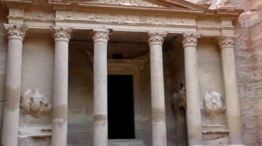 PETRA, JORDAN CIRCA 2016 - Low angle view of the facade of the Treasury building in the ancient Nabatean ruins of Petra, Jordan.