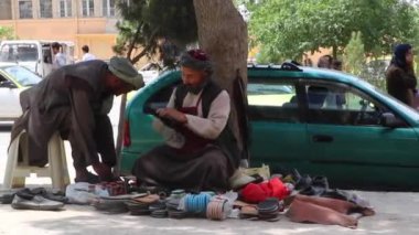 Kabil, Afganistan 'daki ayakkabı temizleyicilerinin görüntüleri.
