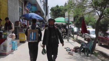 Unidentified people in Kabul, the capital of Afghanistan, circa May 2019