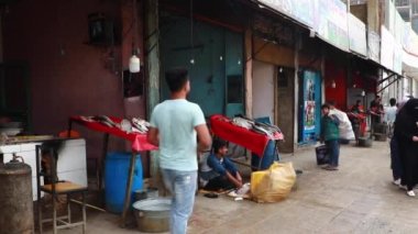 Unidentified people at a market in Kabul, the capital of Afghanistan, circa May 2019
