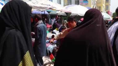 Unidentified people at a market in Kabul, the capital of Afghanistan, circa May 2019