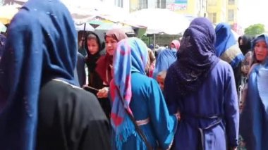 Unidentified people at a market in Kabul, the capital of Afghanistan, circa May 2019