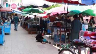 Unidentified people at a market in Kabul, the capital of Afghanistan, circa May 2019