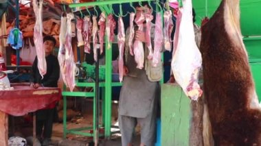 Unidentified people at  meat market in Kabul, the capital of Afghanistan, circa May 2019