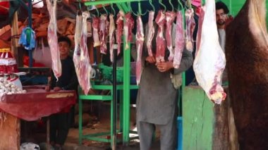 Unidentified people at  meat market in Kabul, the capital of Afghanistan, circa May 2019