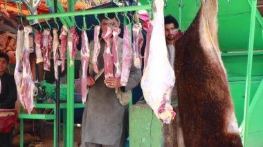 Unidentified people at  meat market in Kabul, the capital of Afghanistan, circa May 2019