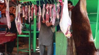 Unidentified people at  meat market in Kabul, the capital of Afghanistan, circa May 2019