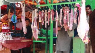 Unidentified people at  meat market in Kabul, the capital of Afghanistan, circa May 2019